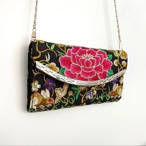 Black floral clutch purse with crossbody chain